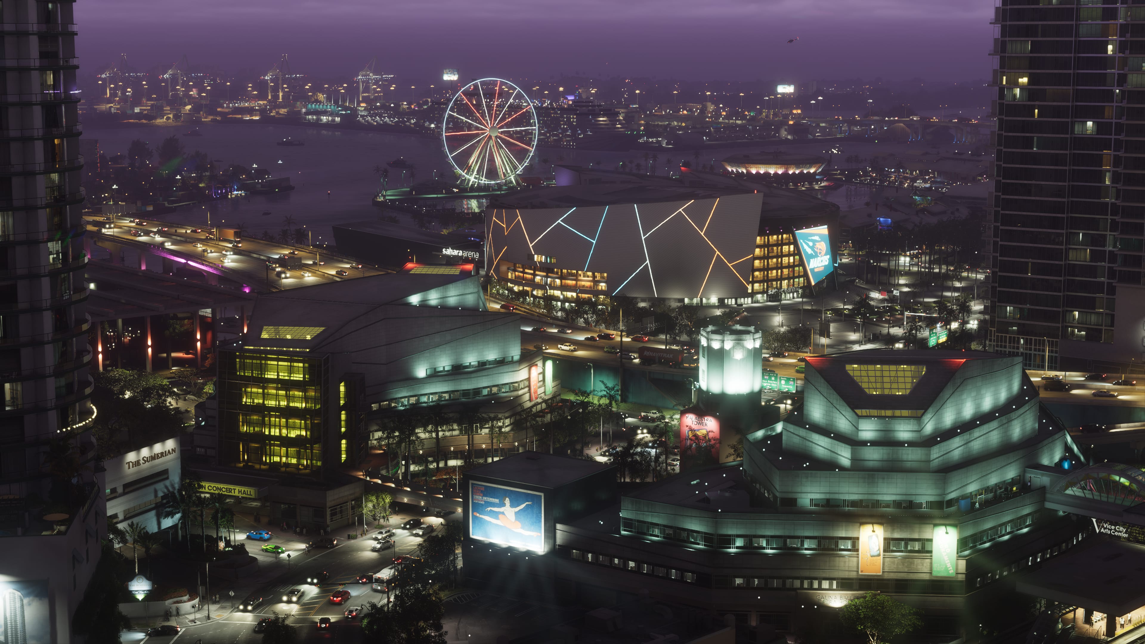 Aerial view of downtown Vice City lit up at night in GTA 6